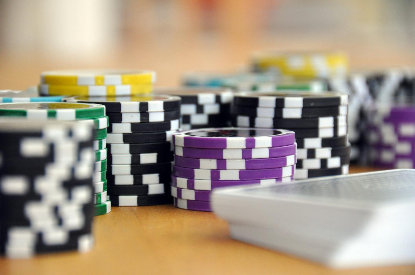 Casino chips and playing cards on a table